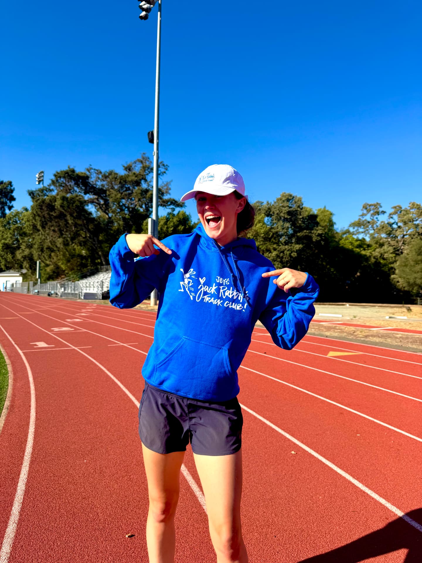 Runner wearing the Joy's Jackrabbits pilot collection hoodie on the track
